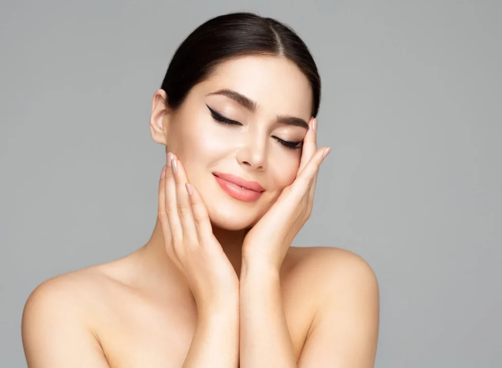 Woman with closed eyes and smiling face after Skin Analysis in San Mateo, CA