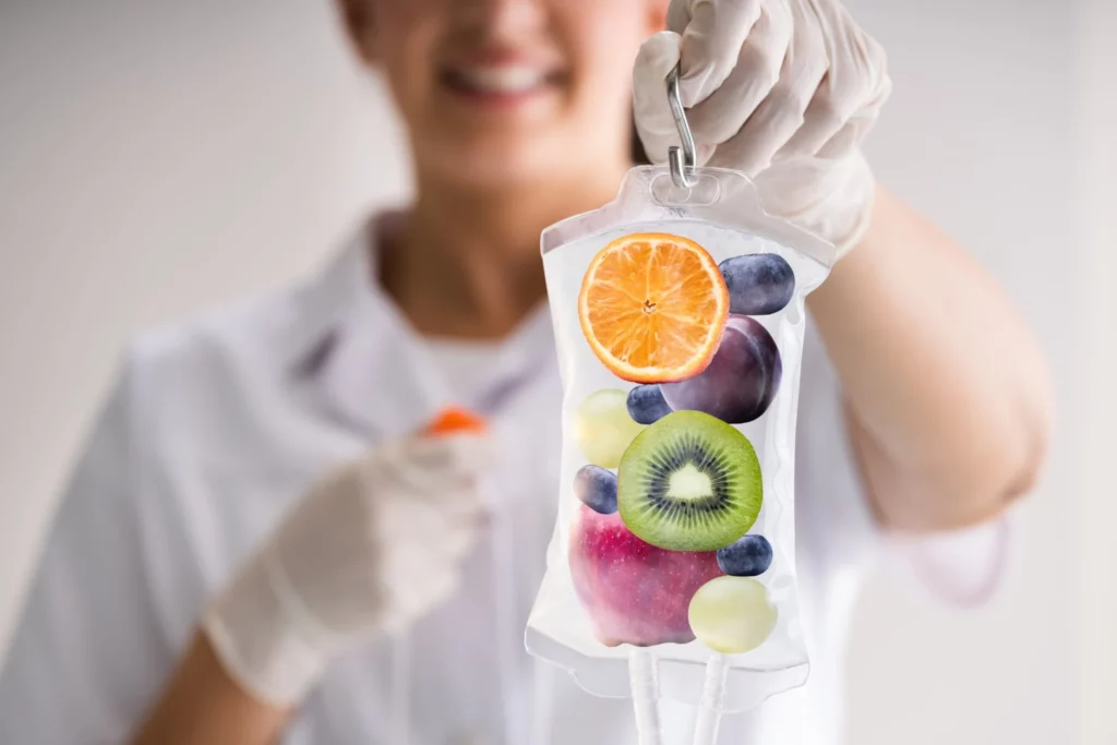 Aesthetician holding IV Drip and Pouch at The Space Aesthetics in San Mateo, CA
