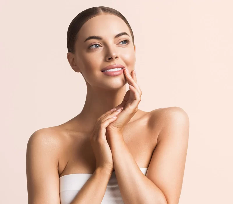 Woman with beautiful smile and skin after filler treatment in San Mateo, CA