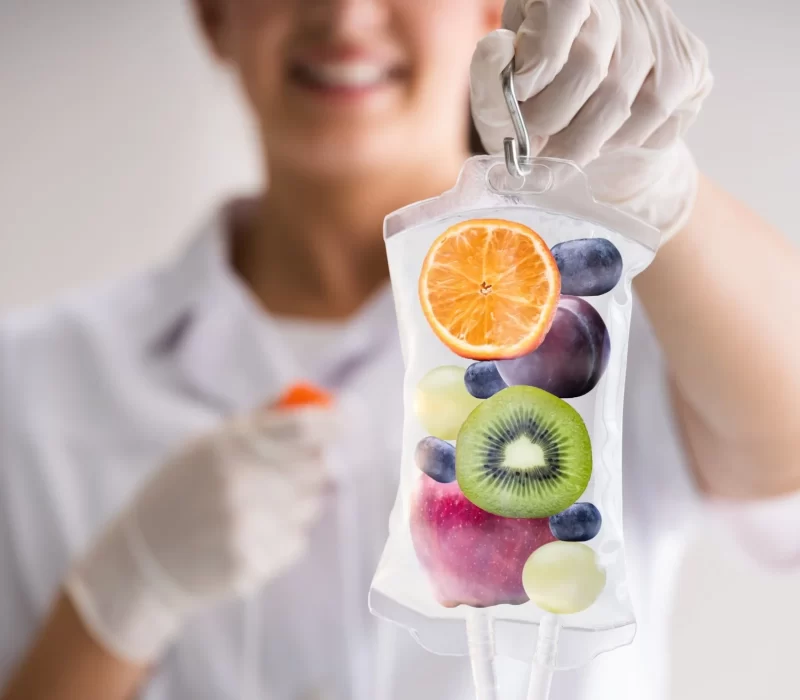 Aesthetician holding IV Drip and Pouch at The Space Aesthetics in San Mateo, CA